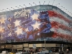 The mural in Enghelab Square shows a bird's-eye view of an aircraft craft with damaged and exploding fighter planes on its flight deck. 