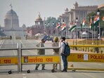 New Delhi: Delhi Police personnel check a man's documents as a defence officer looks on ahead of Republic Day celebrations at Kartavya Path in New Delhi, Saturday, Jan. 24, 2026. (PTI Photo)(PTI01_24_2026_000231B)