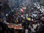 A crowd of protesters against Immigration and Customs Enforcement (ICE) march through the streets of downtown Minneapolis, Minnesota, on January 25.