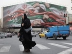 Iran-US tensions: An Iranian woman walks on a street in Tehran, Iran, amid settled protests in the country.
