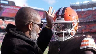 Cleveland Browns quarterback Shedeur Sanders greets his dad Deion Sanders. (AP) Cleveland Browns quarterback Shedeur Sanders greets his dad Deion Sanders. (AP)