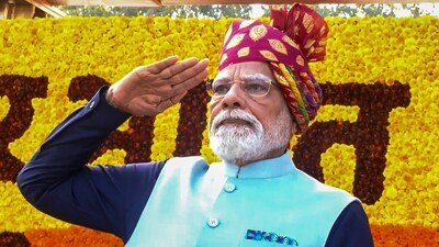 Prime Minister Narendra Modi exchanges salute with the armed forces during the 77th Republic Parade at New Delhi's Kartavya Path today. (YT/@NarendraModi)
