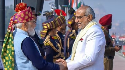 Prime Minister Narendra Modi shakes hand and receives vice president CP Radhakrishnan during the 77th Republic Day parade at Kartavya Path in New Delhi today. (YT/@NarendraModi)