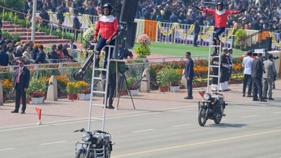 Daredevil soldiers perform a motorcycle stunt during India's 77th Republic Day parade at Kartavya Path (Raj K Raj/HT Photo)