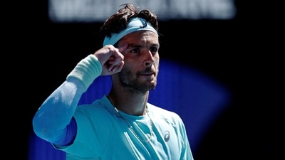 Italy's Lorenzo Musetti celebrates after winning his fourth round match against Taylor Fritz of the U.S. (REUTERS)
