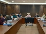 Gurugram mayor and municipal commissioner with senior officials at the meeting at MCG office in Sector 34 on Tuesday. (HT Photo)