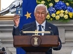 Antonio Costa, president of the European Council, holds his Overseas Citizen of India card during a news conference at Hyderabad House in New Delhi, India, on Tuesday.