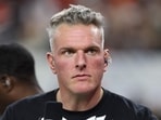 ESPN's Pat McAfee looks on in the third quarter of a game between the Miami Hurricanes.