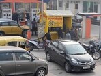 People seen waiting in long queues to get the PUC check of their vehicles done. (HT Archive)