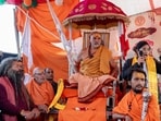Swami Avimukteshwaranand Saraswati, head of Jyotish Peeth Badrinath, sits with followers outside his Magh Mela camp in protest (AP) Swami Avimukteshwaranand Saraswati, head of Jyotish Peeth Badrinath, sits with followers outside his Magh Mela camp in protest (AP)