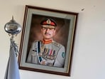 A broken frame of Pakistan's field marshal and army chief, Asim Munir, hangs on the wall after an attack at the Cadet College Wana, a military-linked school, in the South Waziristan district near the Pakistan-Afghanistan border.