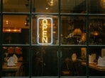 An "Open" sign in the window of a restaurant near Liverpool Street in the City of London, UK, on Tuesday, Jan. 27, 2026.