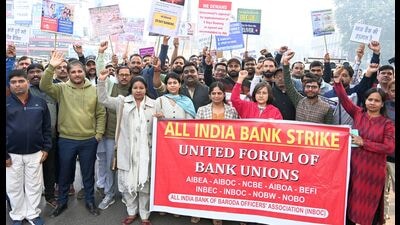 Bank employees staging a protest in Prayagraj on Tuesday (HT) Bank employees staging a protest in Prayagraj on Tuesday (HT)