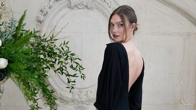 Karlie Kloss poses for photographers at the photo call for the Christian Dior Spring/Summer 2026 Haute Couture collection presented in Paris. She picked a black backless dress for the occasion. (AP) Karlie Kloss poses for photographers at the photo call for the Christian Dior Spring/Summer 2026 Haute Couture collection presented in Paris. She picked a black backless dress for the occasion. (AP)