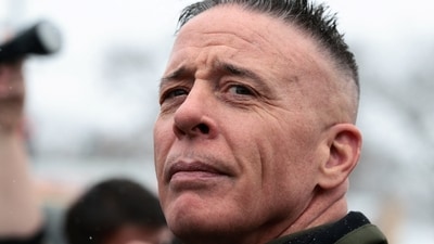 Border Patrol commander Greg Bovino looks on at a gas station, as immigration enforcement continues, January 21. (REUTERS)