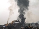 A plume of smoke rises in an open-cast mine on the outskirts of Dhanbad in Jharkhand. (AFP)