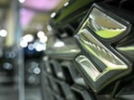 The Maruti Suzuki brand logo is seen on a vehicle during the 4th International Autoshow 2025 at the Palace Grounds in Bengaluru on November 14, 2025. (Photo by Idrees MOHAMMED / AFP)
