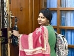 Roshan Khatoon, a housekeeper, has just finished her evening work in a central Delhi household, and is getting ready to leave for home. With an umbrella and pithu bag in hand, she patiently agrees to become a part of our Proust Questionnaire series. (HT Photo)