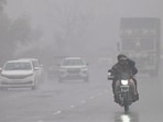 Showers drench commuters in Ludhiana on Tuesday. (Gurpreet Singh/HT)