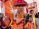 Swami Avimukteshwaranand Saraswati, head of Jyotish Peeth Badrinath, sits with followers outside his Magh Mela camp in protest 