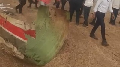 Parts of the severed aircraft lies near the crash site in Maharashtra's Baramati. Maharashtra's deputy chief minister Ajit Pawar was onboard the aircraft as he was heading to the city to address public meetings ahead of the Zilla Parishad elections in the state. (Screengrab/Hindustan Times)