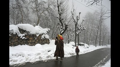 On Tuesday, light to moderate snowfall disrupted life in the Kashmir valley, including Srinagar city, with all flights cancelled at Srinagar airport and many major roads, including the Srinagar-Jammu national highway, closed. (Waseem Andrabi /HT) On Tuesday, light to moderate snowfall disrupted life in the Kashmir valley, including Srinagar city, with all flights cancelled at Srinagar airport and many major roads, including the Srinagar-Jammu national highway, closed. (Waseem Andrabi /HT)