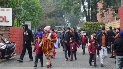 Parents escorting their wards from a school in Sector 28, Chandigarh, on Wednesday after the bomb scare. (Ravi Kumar/HT) Parents escorting their wards from a school in Sector 28, Chandigarh, on Wednesday after the bomb scare. (Ravi Kumar/HT)