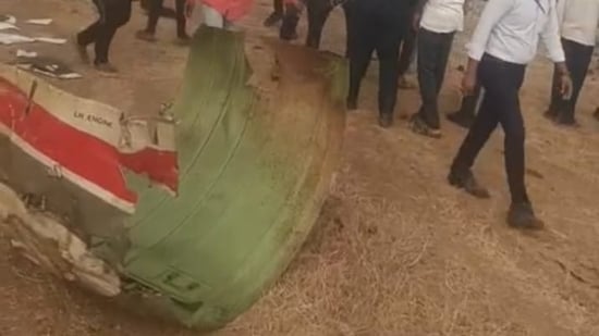 Parts of the severed aircraft lies near the crash site in Maharashtra's Baramati. Maharashtra's deputy chief minister Ajit Pawar was onboard the aircraft as he was heading to the city to address public meetings ahead of the Zilla Parishad elections in the state.(Screengrab/Hindustan Times)