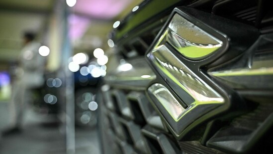 The Maruti Suzuki brand logo is seen on a vehicle during the 4th International Autoshow 2025 at the Palace Grounds in Bengaluru on November 14, 2025. (Photo by Idrees MOHAMMED / AFP) (AFP)