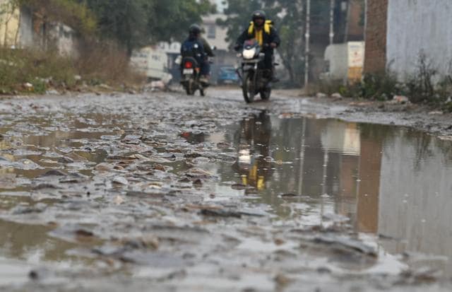 A waterlogged stretch of a road in Sector 110 as seen on Tuesday. (Parveen Kumar/HT) A waterlogged stretch of a road in Sector 110 as seen on Tuesday. (Parveen Kumar/HT)