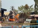 Forensic team and police personnel present at spot where a fire broke out in a manufacturing unit at Anandapur on Monday.