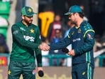 Pakistan's Salman Ali Agha, left, shakes hand with Australia's Travis Head after coin toss for the first T20 cricket match between Pakistan and Australia, in Lahore