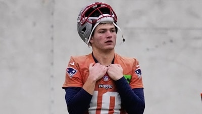 New England Patriots quarterback Drake Maye watches teammates during an NFL football availability (AP) New England Patriots quarterback Drake Maye watches teammates during an NFL football availability (AP)