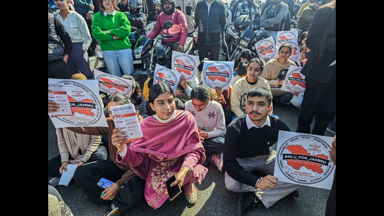 Jammu University students stage a protest to demand National Law University in the state, in Jammu on Thursday. (ANI)
