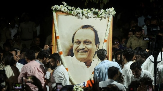 Supporters pay last respects to Ajit Pawar at his funeral. Pawar lost his life after a VSR Ventures-operated Learjet 45 aircraft underwent a fatal crash on Wednesday at Baramati. The leader was travelling to his hometown Baramati to address public meetings ahead of Zilla Parishad polls in the state.(REUTERS)