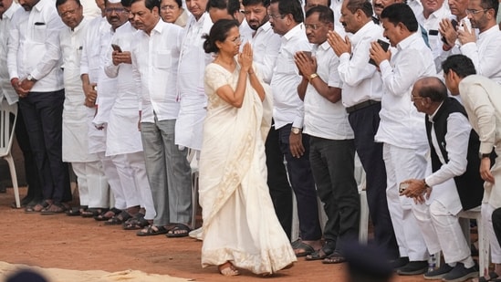 NCP-SP leader Supriya Sule greets attendees at deputy chief minister and her cousin Ajit Pawar's funeral in Baramati today.(PTI)