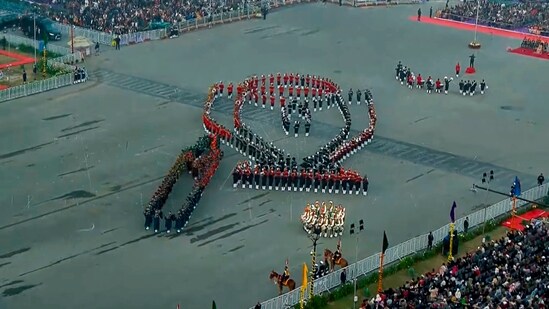 Armed forces personnel form a trophy-shaped formation to pay tribute to India's ICC Women's Cricket World Cup 2025 victory during the Beating Retreat ceremony.(PTI)
