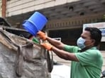New Delhi, India - July 20, 2019: NDMC worker collecting dry and wet segregation garbage door to door at D Block Prasant Vihar . in New Delhi, India, on Saturday, July 20, 2019. (Photo by Raj K Raj/ Hindustan Times) **To go with Baishali's story (Raj K Raj/HT PHOTO)