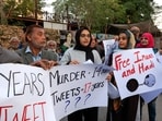 Activists, lawyers and journalists carry posters as they gather in solidarity with human rights activist and lawyer, Imaan Mazari and her husband after court convicted them on charges of anti-state social media posts.