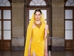 Indriya’s temple jewellery features an intricate haar paired with saree gown