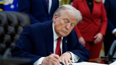 US President Donald Trump signs an executive order in the Oval Office of the White House in Washington, DC, US. (Bloomberg) US President Donald Trump signs an executive order in the Oval Office of the White House in Washington, DC, US. (Bloomberg)