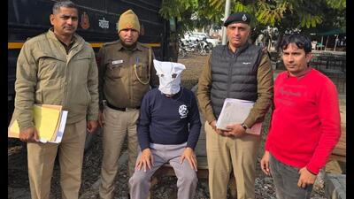 Accused in police custody on Friday. (HT) Accused in police custody on Friday. (HT)