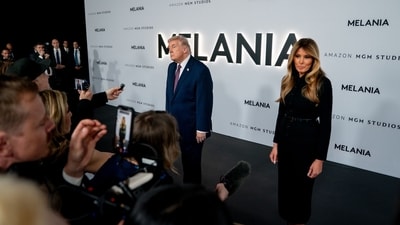 US President Donald Trump, left, and First Lady Melania Trump speak to members of the media while arriving for the world premiere 'Melania' at the Kennedy Center in Washington, DC. (Bloomberg) US President Donald Trump, left, and First Lady Melania Trump speak to members of the media while arriving for the world premiere 'Melania' at the Kennedy Center in Washington, DC. (Bloomberg)