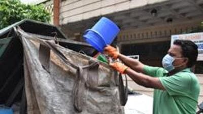 New Delhi, India - July 20, 2019: NDMC worker collecting dry and wet segregation garbage door to door at D Block Prasant Vihar . in New Delhi, India, on Saturday, July 20, 2019. (Photo by Raj K Raj/ Hindustan Times) **To go with Baishali's story (Raj K Raj/HT PHOTO) New Delhi, India - July 20, 2019: NDMC worker collecting dry and wet segregation garbage door to door at D Block Prasant Vihar . in New Delhi, India, on Saturday, July 20, 2019. (Photo by Raj K Raj/ Hindustan Times) **To go with Baishali's story (Raj K Raj/HT PHOTO)