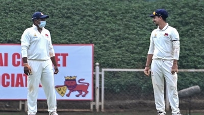 Sarfaraz Khan, left, wears a mask while fielding on the first day of Mumbai's Ranji Trophy match against Delhi. (PTI) Sarfaraz Khan, left, wears a mask while fielding on the first day of Mumbai's Ranji Trophy match against Delhi. (PTI)