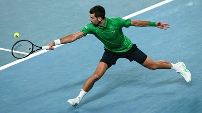 But Djokovic was not done yet, breaking Sinner's serve early in the fourth set to level the match once again. (AFP) But Djokovic was not done yet, breaking Sinner's serve early in the fourth set to level the match once again. (AFP)