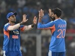 India vs New Zealand 5th T20I Highlights: India's Axar Patel (R) celebrates with captain Suryakumar Yadav after taking the wicket of New Zealand's Finn Allen.