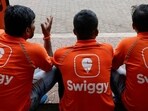 FILE PHOTO: Swiggy gig workers talk to each other during a promotional event in Mumbai, India, October 14, 2024. REUTERS/Francis Mascarenhas/File Photo (REUTERS)