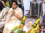 Sunetra Pawar greets people as they arrive to pay last respects to Ajit Pawar at their family residence in Baramati, Pune,