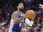 Philadelphia 76ers forward Paul George (8) shoots the ball against the Milwaukee Bucks